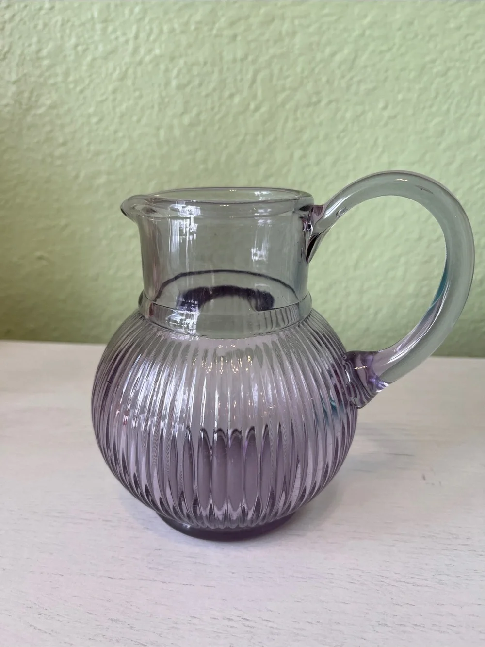 Vintage or decorative lavender/amethyst ribbed glass pitcher